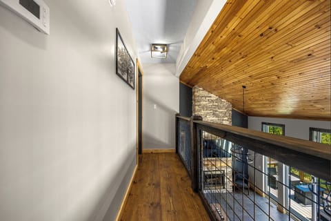 The top floor hallway leading to the king bedroom with twin bunk beds. 