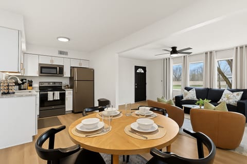 Open-concept layout connecting kitchen, dining, and living areas for effortless entertaining.