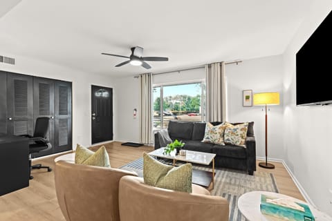 Spacious open-concept living room with stylish décor and direct access to your private entrance.