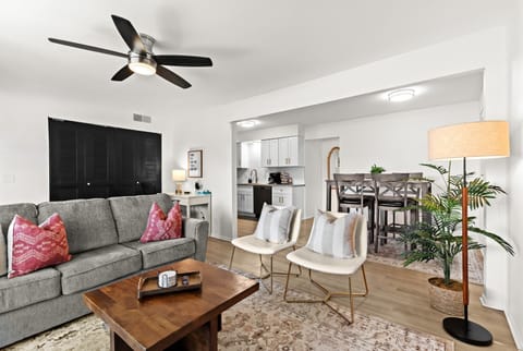 Spacious open-concept living room with cozy sectional seating and plenty of natural light.