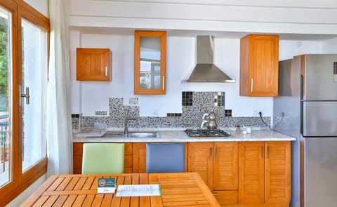 Comfort Apartment, 2 Bedrooms, Balcony, Partial Sea View | Private kitchen | Fridge, stovetop, cookware/dishes/utensils