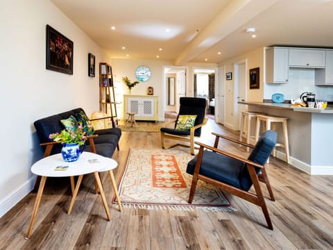 Furniture, Interior Design, Flooring, Floor, Couch, Wood Flooring, Wall, Living Room, Wood, Chair