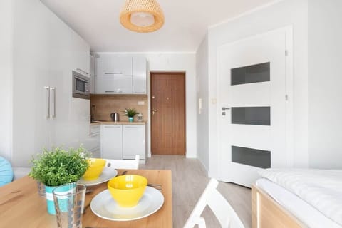 Dining area and view of the fully equipped kitchen.