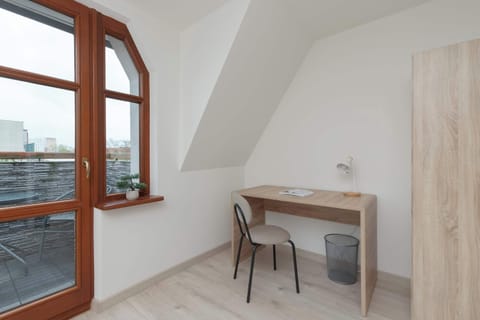 The desk is located in the bedroom, which will allow you to focus on your work.