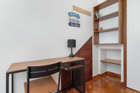 A practical workspace with a desk and chair, placed by the window for natural light – ideal for studying or remote work.
