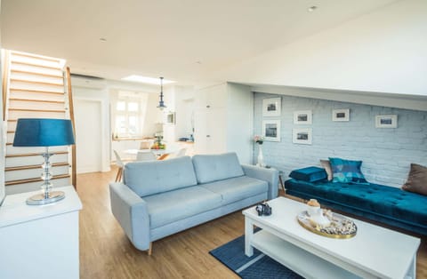 Living room with a comfortable sofa and TV. 