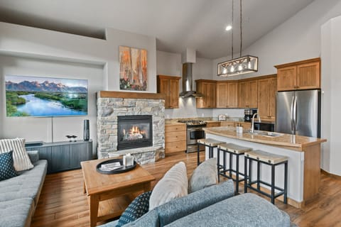 Living Area With Gas Fireplace and 65" HDTV