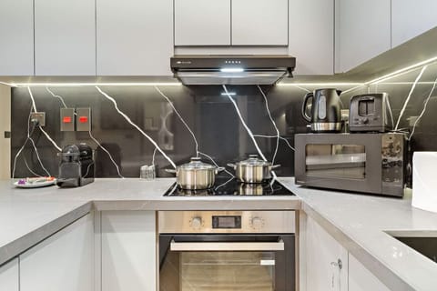 Kitchen: Sleek, modern design with top-notch appliances for culinary adventures!