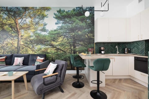 Kitchenette with oven and refrigerator. 