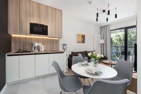 A wider view of the kitchen area, showcasing its clean design and ample counter space.