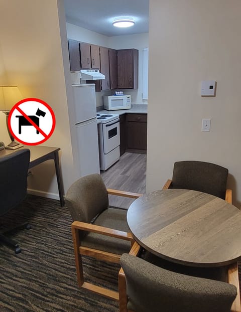 Suite, 2 Queens with a separate 1 Bedroom, Kitchen (Non-PetFriendly) | Living area | 40-inch TV with cable channels