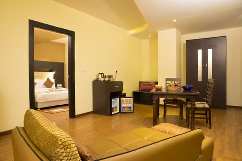 Junior Suite, 1 Double Bed | Living room | Flat-screen TV