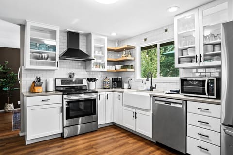 Fully stocked kitchen with coffee station.