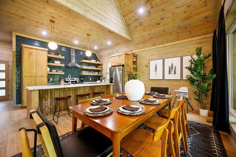 Cooking, dining, and bonding—all in one welcoming space. Our fully stocked kitchen flows into the dining area, complete with a high chair so even your tiniest traveler has a seat at the table!