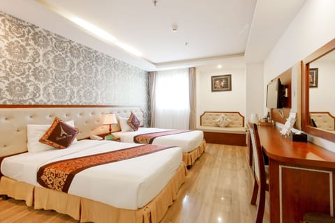 Deluxe Twin Room, City View | Minibar, in-room safe, individually decorated, desk