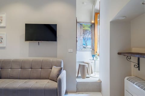 Luxury Triple Room, City View | Desk, laptop workspace, free WiFi