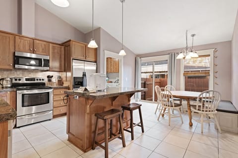 Spacious kitchen with island and sliding door to the patio