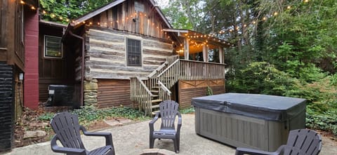 The original 1800s structure sits in the back of the property with large porch area attached.