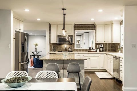 Closer look over dining table/kitchen with island seating