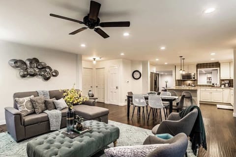 view from living room towards kitchen and family room - to the left see the doors leading to the 2 main floor bedrooms with queen beds