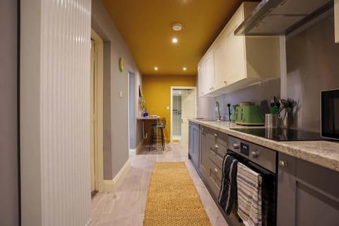 A full kitchen includes all the essential appliances and fixtures needed for cooking, preparing, and storing food.