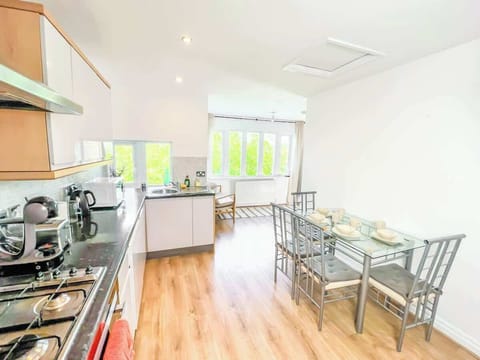 A stylish and functional space designed for enjoying meals, featuring a dining table and comfortable seating.