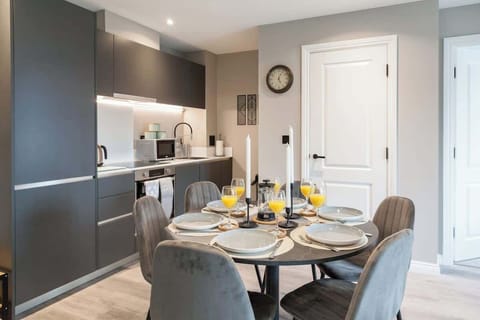 A beautifully designed dining area with a spacious table, offering the perfect setting for home-cooked meals or takeout from nearby restaurants