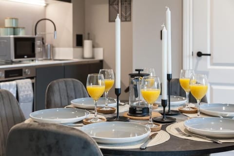 The living room is bright and inviting, featuring a comfortable sofa positioned perfectly to create a cozy and stylish seating area.