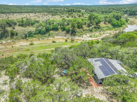 Aerial view of property overlooking Guadalupe River and Hill Country in the distance