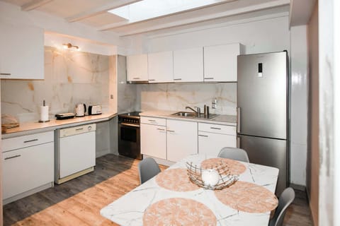 Fully Equipped Kitchen with Modern Dining Table