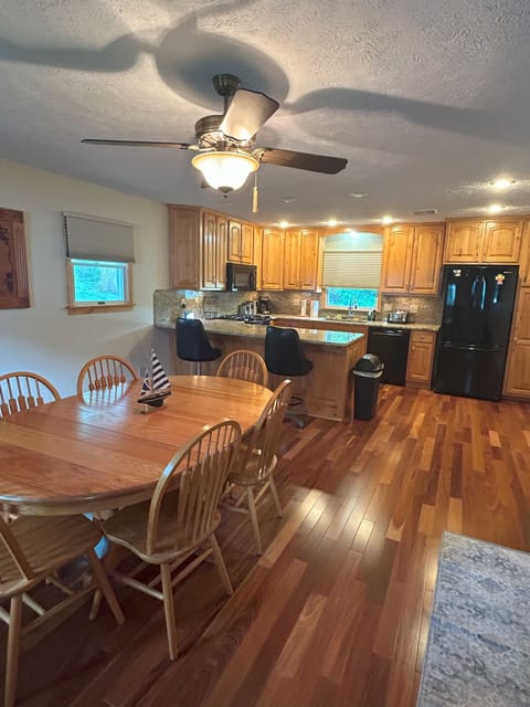 Large dining room adjourns large, fully stocked kitchen