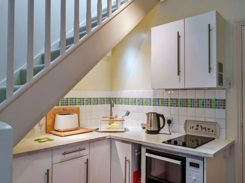 Interior Design, Flooring, Wood, Kitchen, Floor, Countertop, Major Appliance, Furniture, Kitchen Appliance, Room