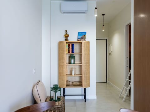 Furniture, Interior Design, Wall, Flooring, Shelving, Shelf, Wood, Floor, Lighting, Room