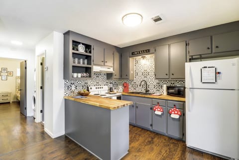 Kitchen, hallway to bathroom, laundry, and bedrooms.