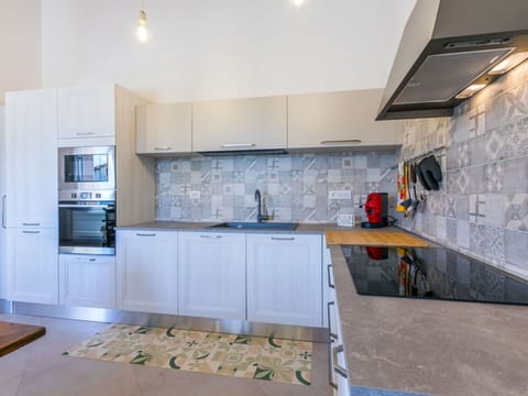 Kitchen, Kitchen Appliance, Countertop, Major Appliance, Flooring, Cabinetry, Floor, Interior Design, Wood, Kitchen Stove