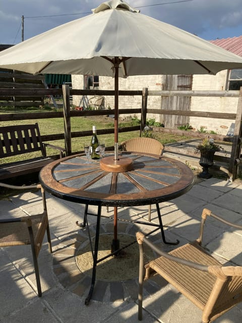 Table with parasol and four chairs