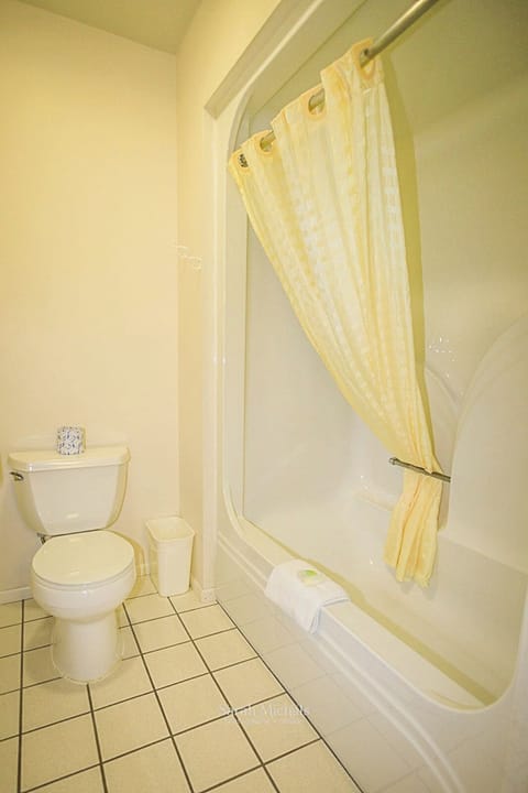 Standard Room, 2 Queen Beds | Bathroom | Combined shower/tub, free toiletries, hair dryer, towels