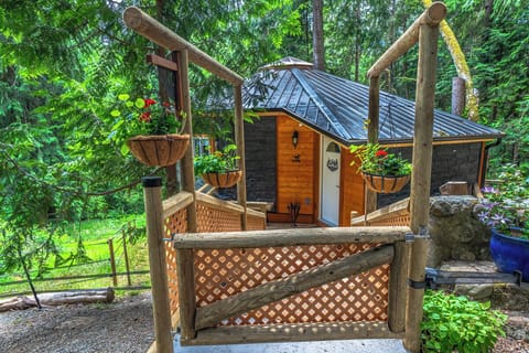 Entryway to the cabin with a propane BBQ on the deck.
