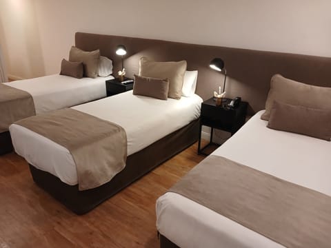 Triple Room, 3 Twin Beds | Minibar, in-room safe, desk, free WiFi