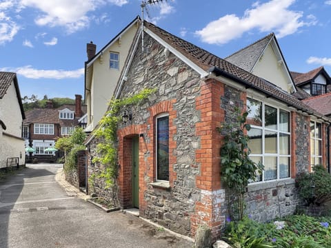 Outside the house where you can pull in