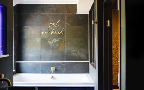 Deluxe Suite | Bathroom | Designer toiletries, hair dryer, towels, soap