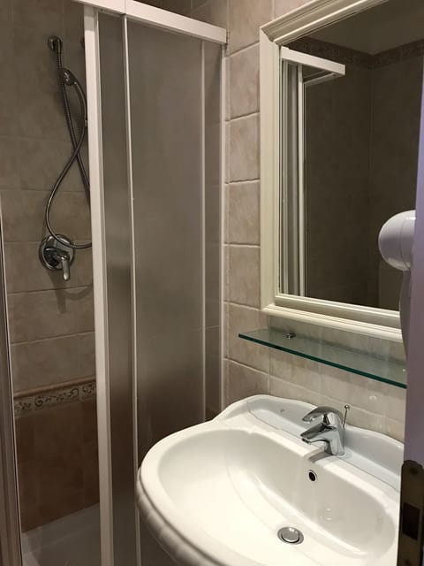 Basic Quadruple Room, Sea View | Bathroom | Shower, free toiletries, hair dryer, towels