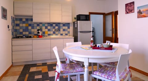 Family Apartment, 2 Bedrooms | Private kitchen | Full-size fridge, microwave, stovetop, espresso maker