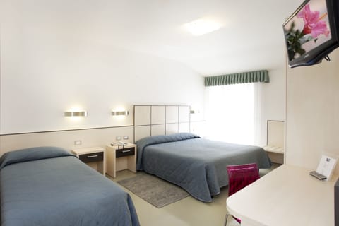 Triple Room, Pool View | Minibar, in-room safe, desk, free WiFi
