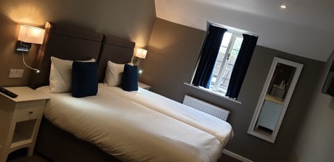 Desk, laptop workspace, free WiFi, bed sheets