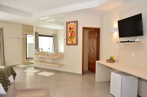 Luxury Triple Room, Jetted Tub, Ground Floor | Minibar, individually decorated, individually furnished