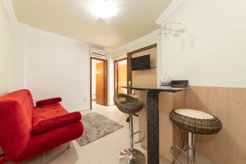 Premium Suite | Living room | 24-inch LCD TV with cable channels, TV