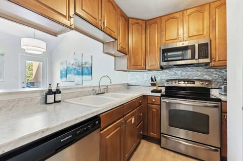 Kitchen: Main floor, drip coffee maker, toaster, cooking utensils, tableware
