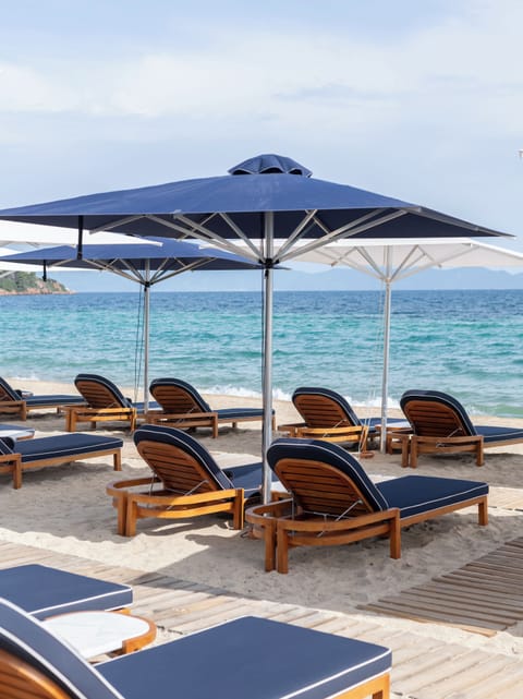 On the beach, sun loungers, beach umbrellas, beach towels