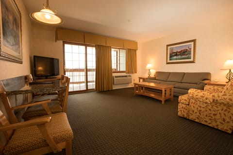 Deluxe Suite, 1 King Bed with Sofa bed, Non Smoking | Living area | Flat-screen TV, DVD player, iPod dock